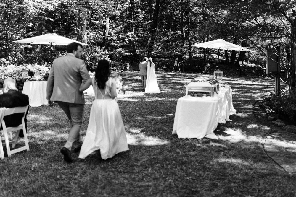 black and white photo of wedding recessional