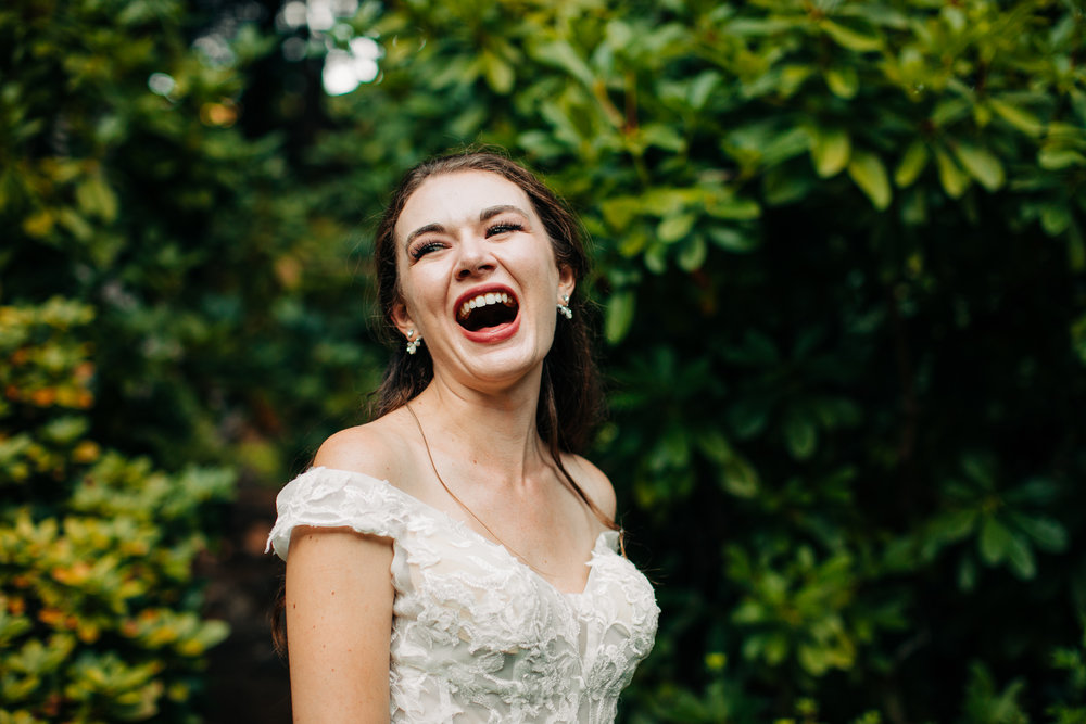 bride laughing while in garden