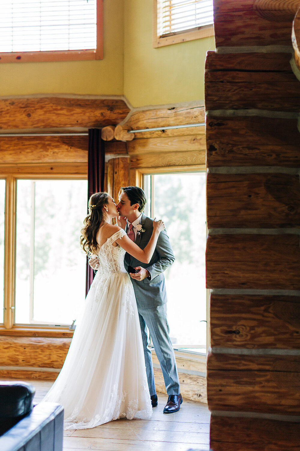 Couple kissing after first look at Gilden Lodge