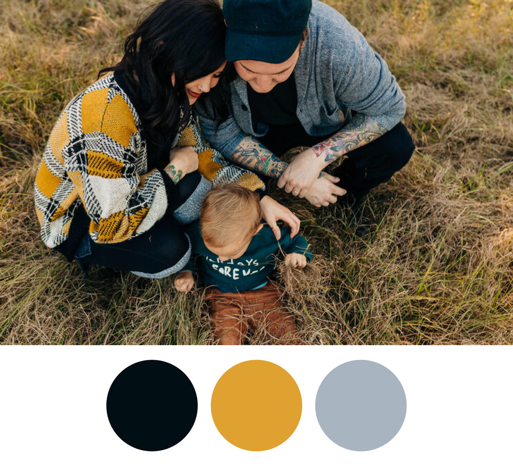 Family with child in gray, black, and yellow coordinated outfits.