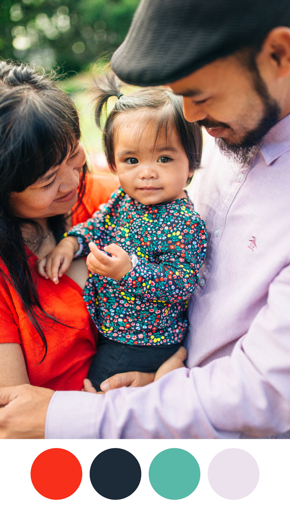 Child in vibrant floral print with mom in bright orange and dad in lavender button down