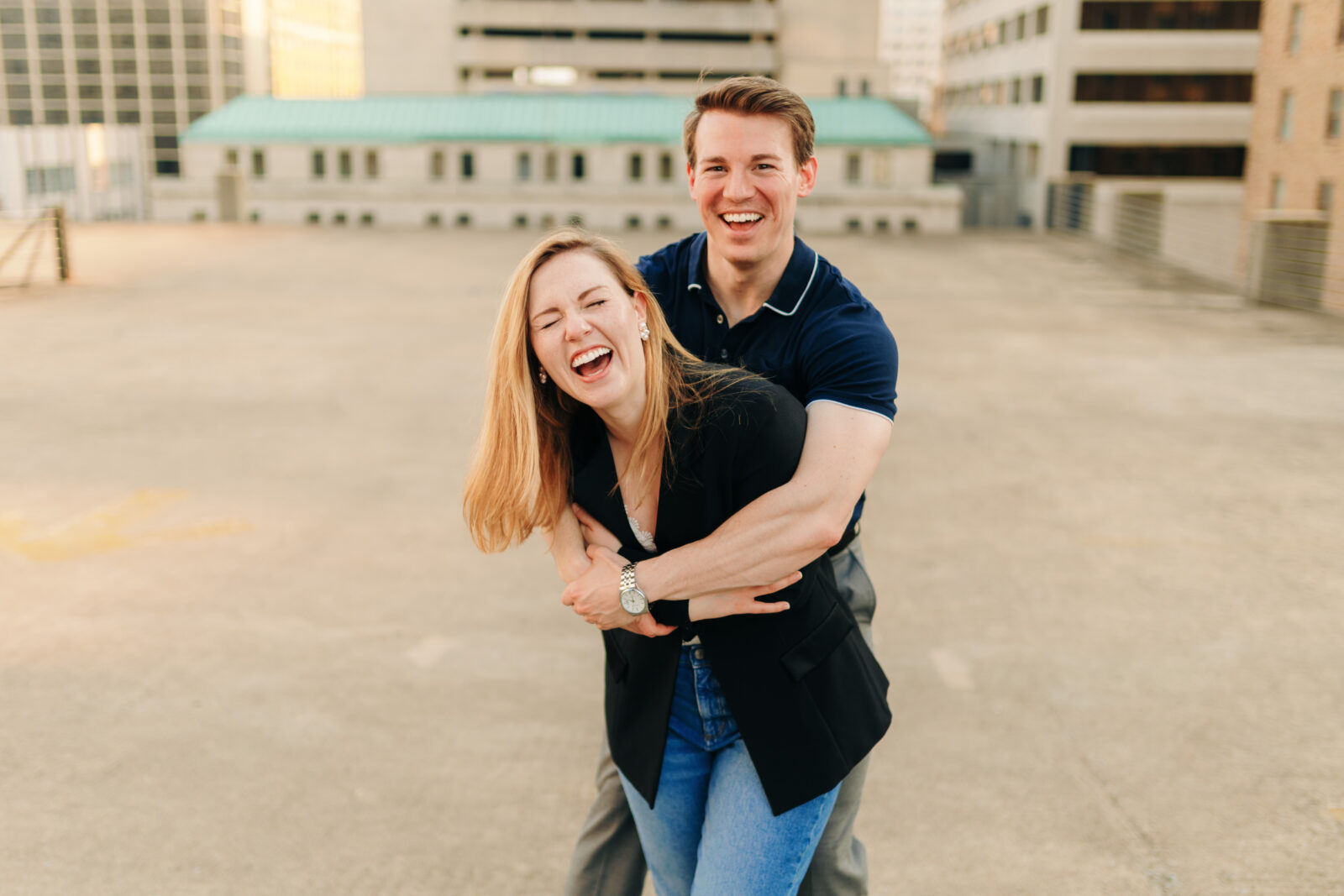 A couple laughing during their downtown engagement session in Memphis