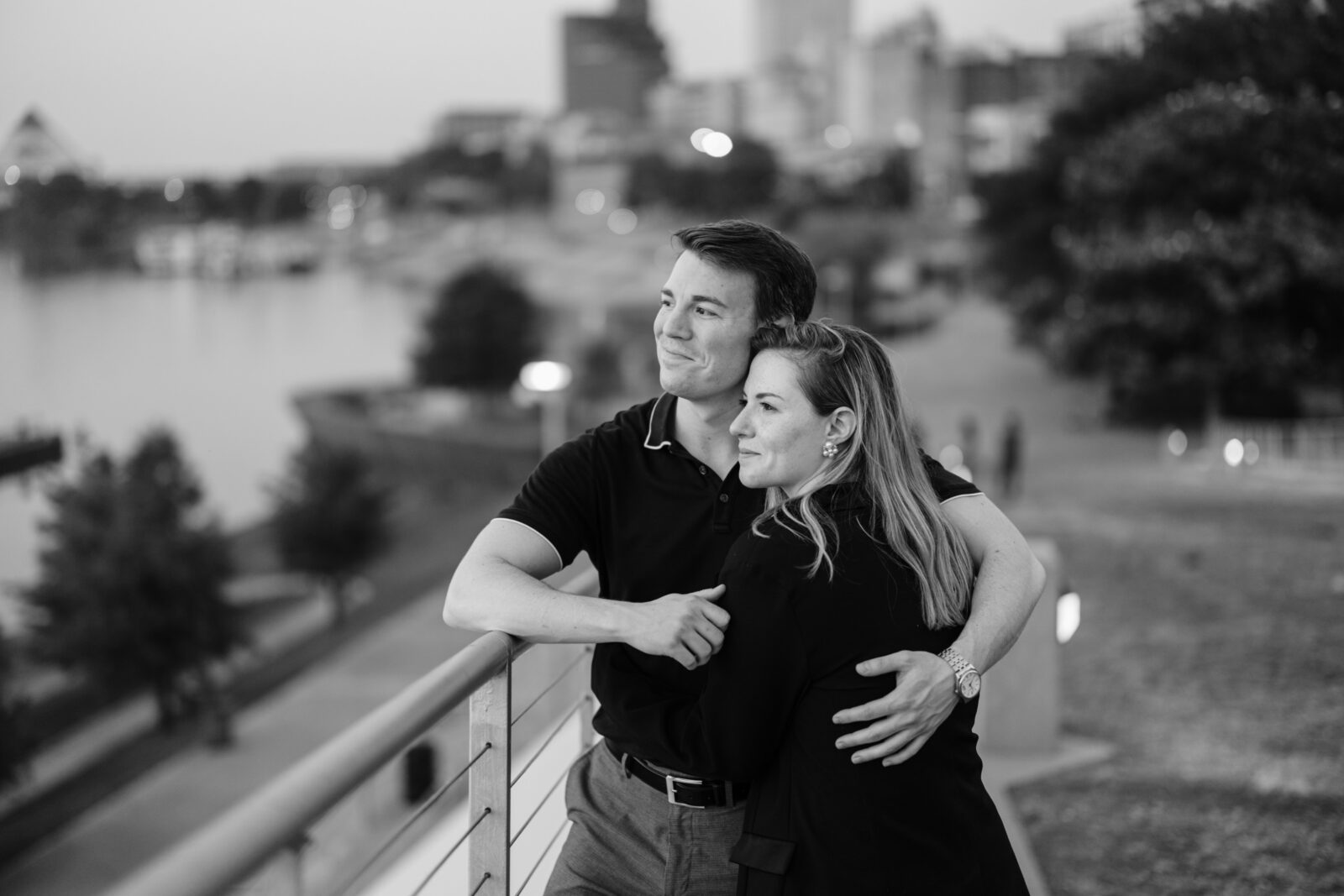 Engaged couple taking in the waterfront view along Beale Street Landing in downtown Memphis